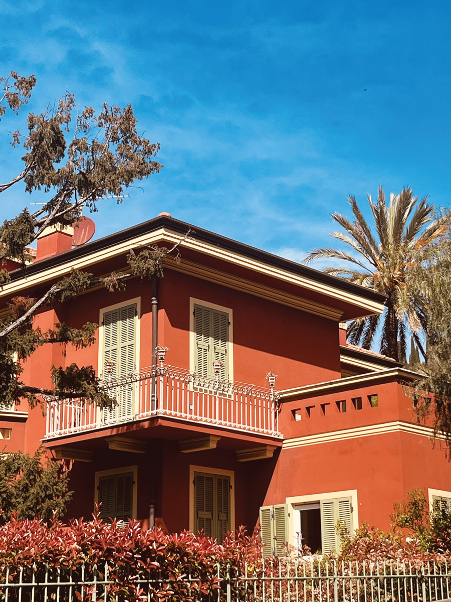 Ochre-coloured building and Mediterranean architecture in Bordighera, Italy