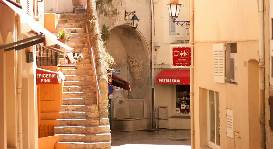 Charming street in the old village of Saint-Tropez explored during a guided walking tour