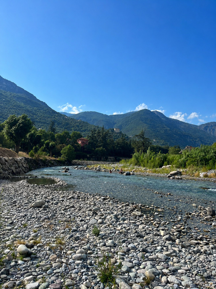 Clear waters of the Roya River flowing through the mountains near Breil-sur-Roya.